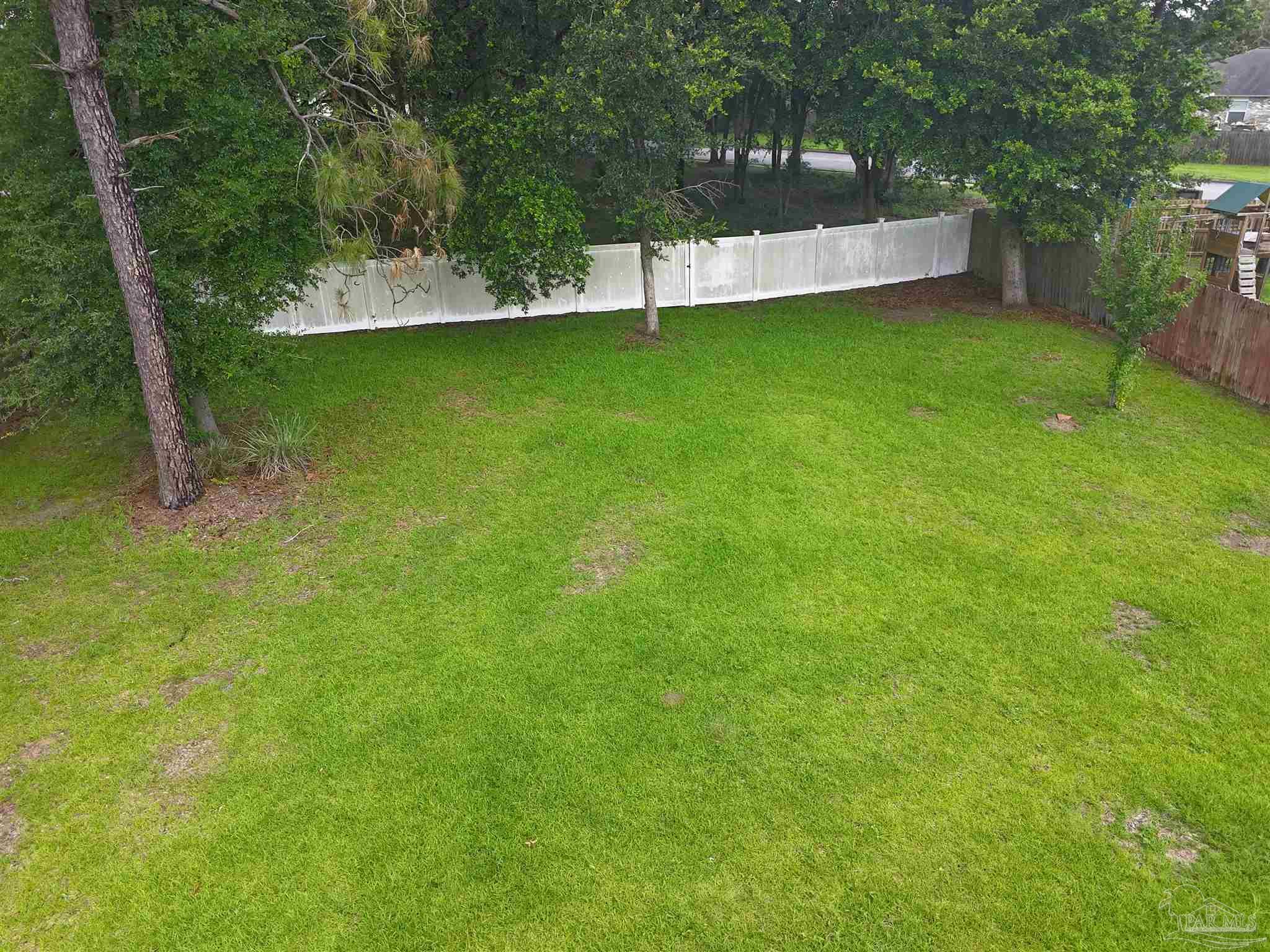 5709 Mill Stream Way Pace, FL 32571 - Photo 12 of 48 a view of a back yard