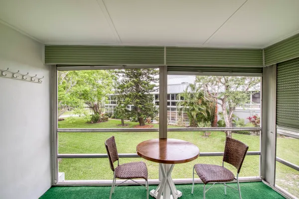 a view of a chairs and table in a room