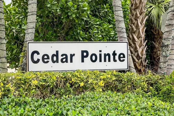 a sign board with a house