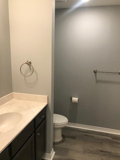 3328 Broadview Circle Crestview, FL 32539 - Photo 11 of 40 a bathroom with a granite countertop sink toilet and a mirror