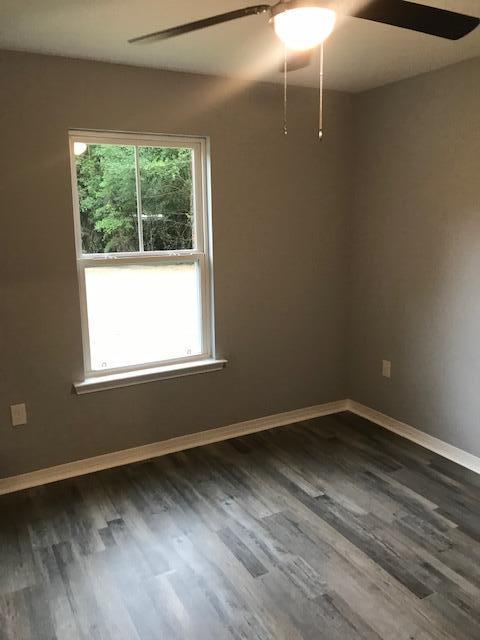 3328 Broadview Circle Crestview, FL 32539 - Photo 13 of 40 a view of a room with wooden floor and window