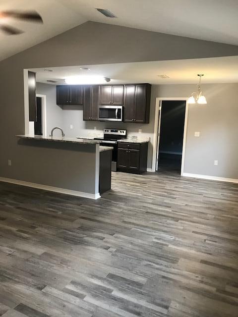 3328 Broadview Circle Crestview, FL 32539 - Photo 16 of 40 a view of kitchen with stainless steel appliances wooden floor