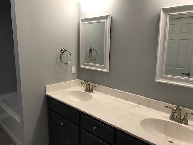 3328 Broadview Circle Crestview, FL 32539 - Photo 29 of 40 a bathroom with a sink and a mirror