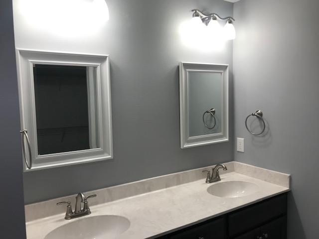 3328 Broadview Circle Crestview, FL 32539 - Photo 36 of 40 a bathroom with a sink and a mirror