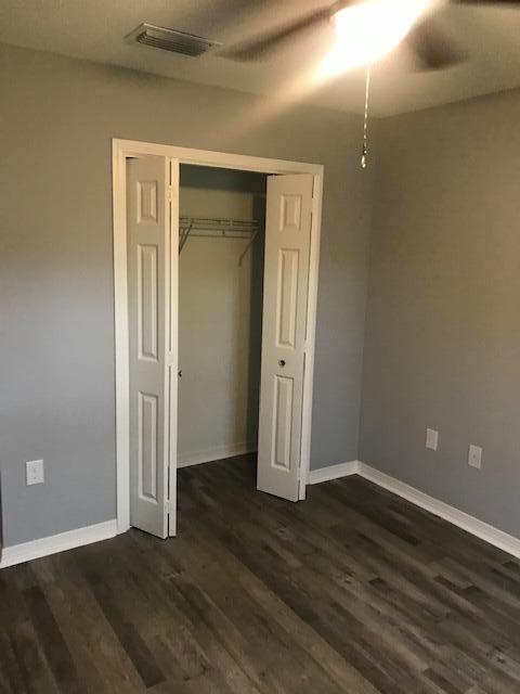 3328 Broadview Circle Crestview, FL 32539 - Photo 8 of 40 an empty room with wooden floor and closet