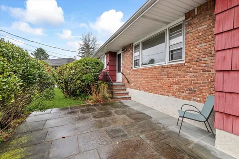 a front view of a house with garden