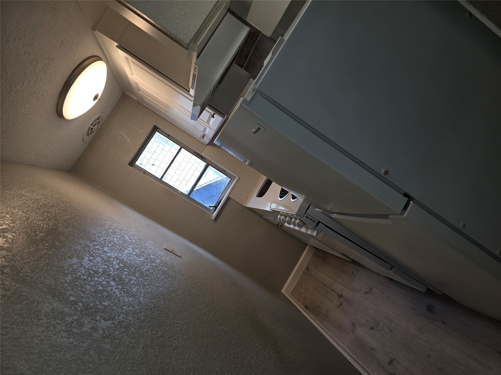 2501 Yoakum Boulevard, Unit 13 Houston, TX 77006 - Photo 14 of 24 a view of an empty room with a window