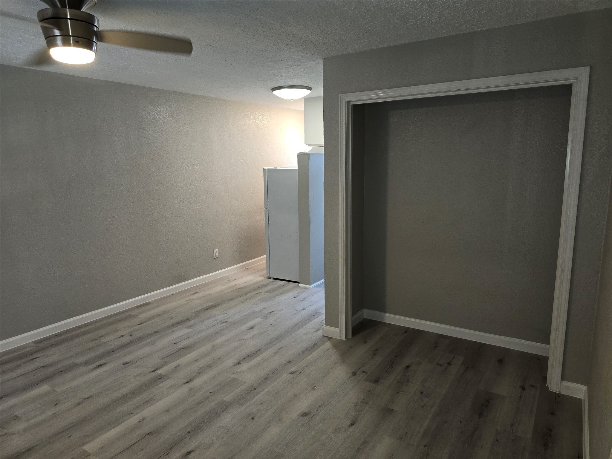 2501 Yoakum Boulevard, Unit 13 Houston, TX 77006 - Photo 22 of 24 wooden floor in an empty room