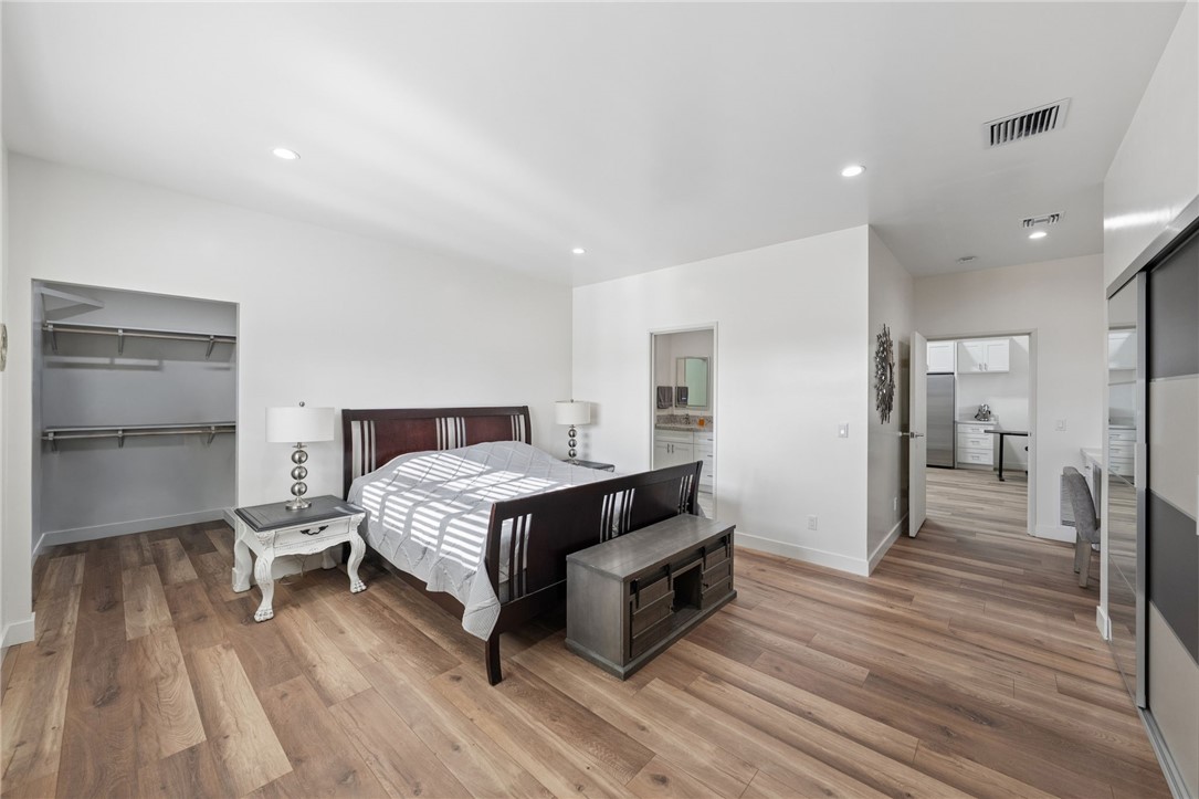 35825 Meadow Ridge Road Temecula, CA 92592 - Photo 70 of 75 a spacious bedroom with a bed and a table