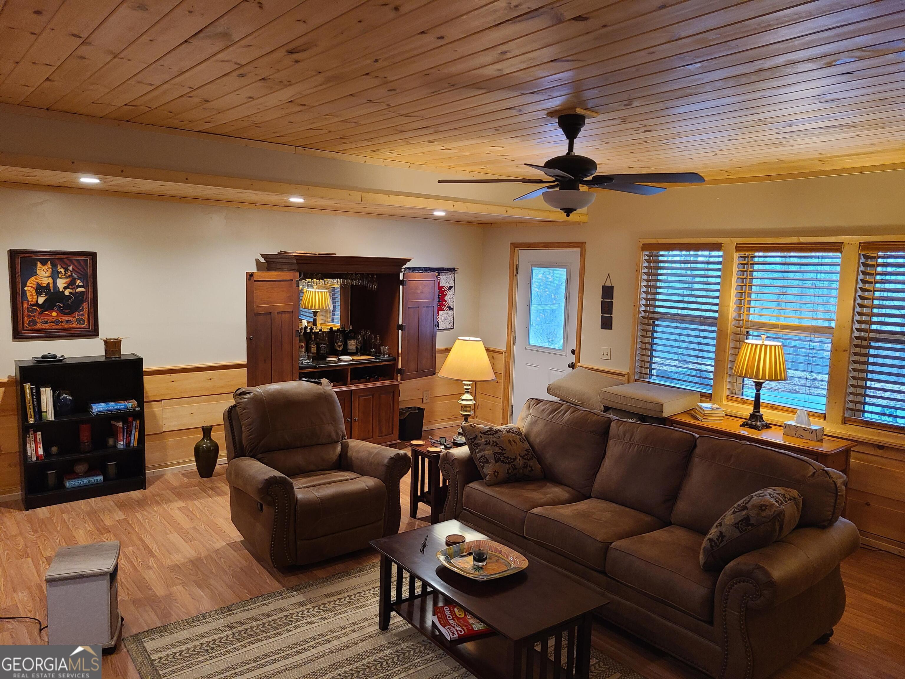 191 Deer Run Road Blairsville, GA 30512 - Photo 15 of 24 a living room with furniture a ceiling fan and a window