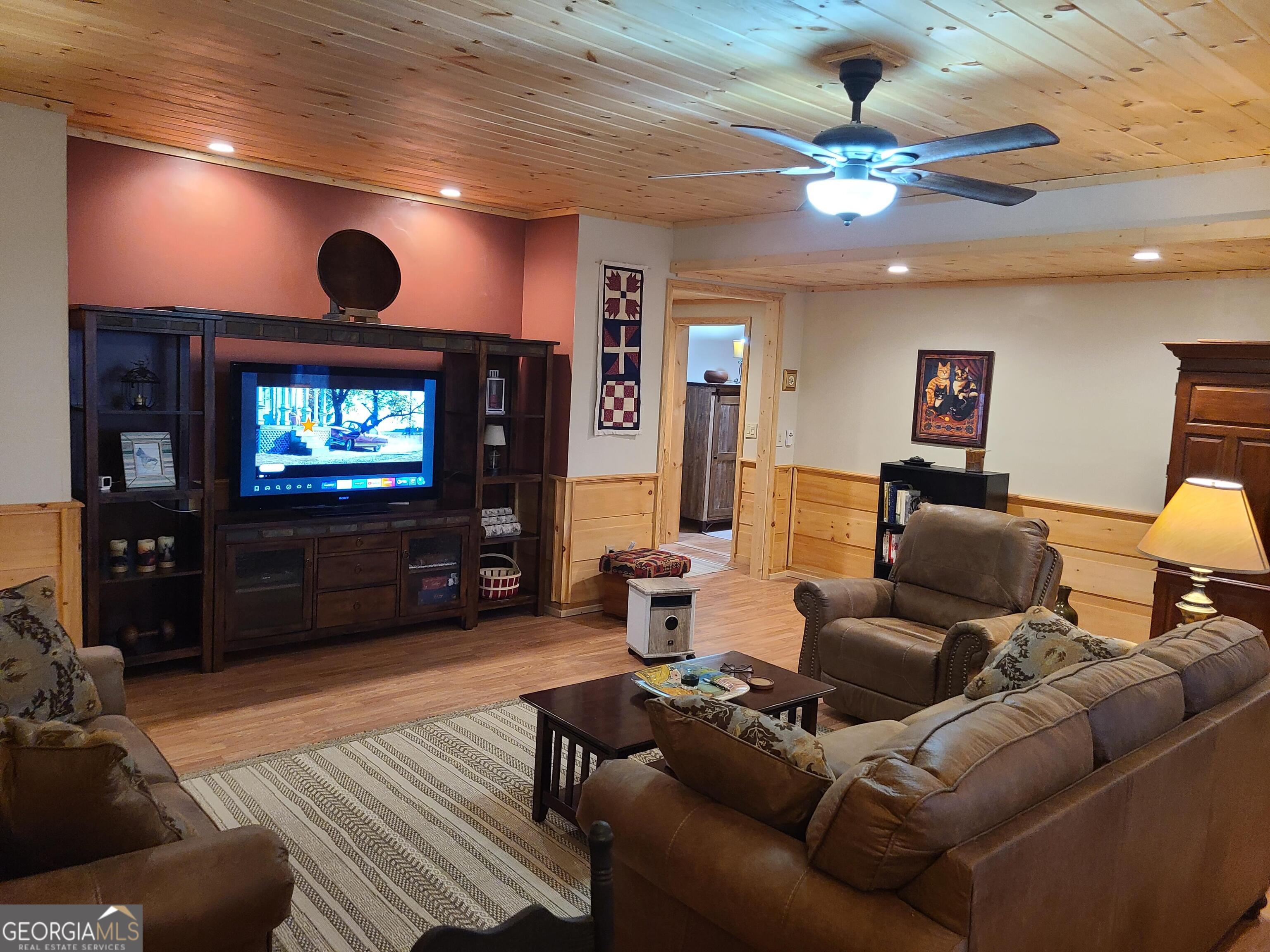 191 Deer Run Road Blairsville, GA 30512 - Photo 16 of 24 a living room with furniture and a flat screen tv