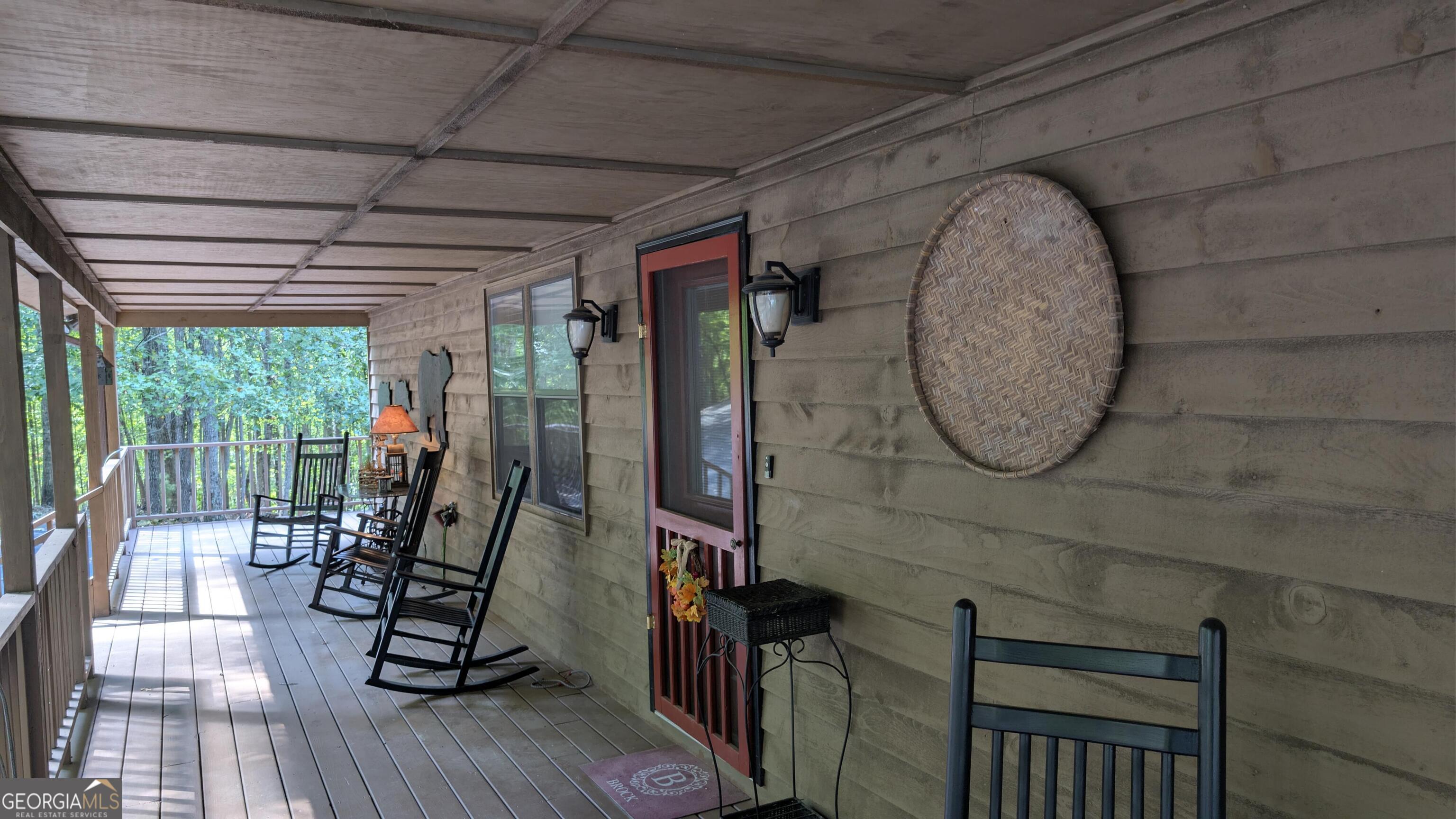 191 Deer Run Road Blairsville, GA 30512 - Photo 4 of 24 a view of a livingroom with furniture and floor to ceiling window