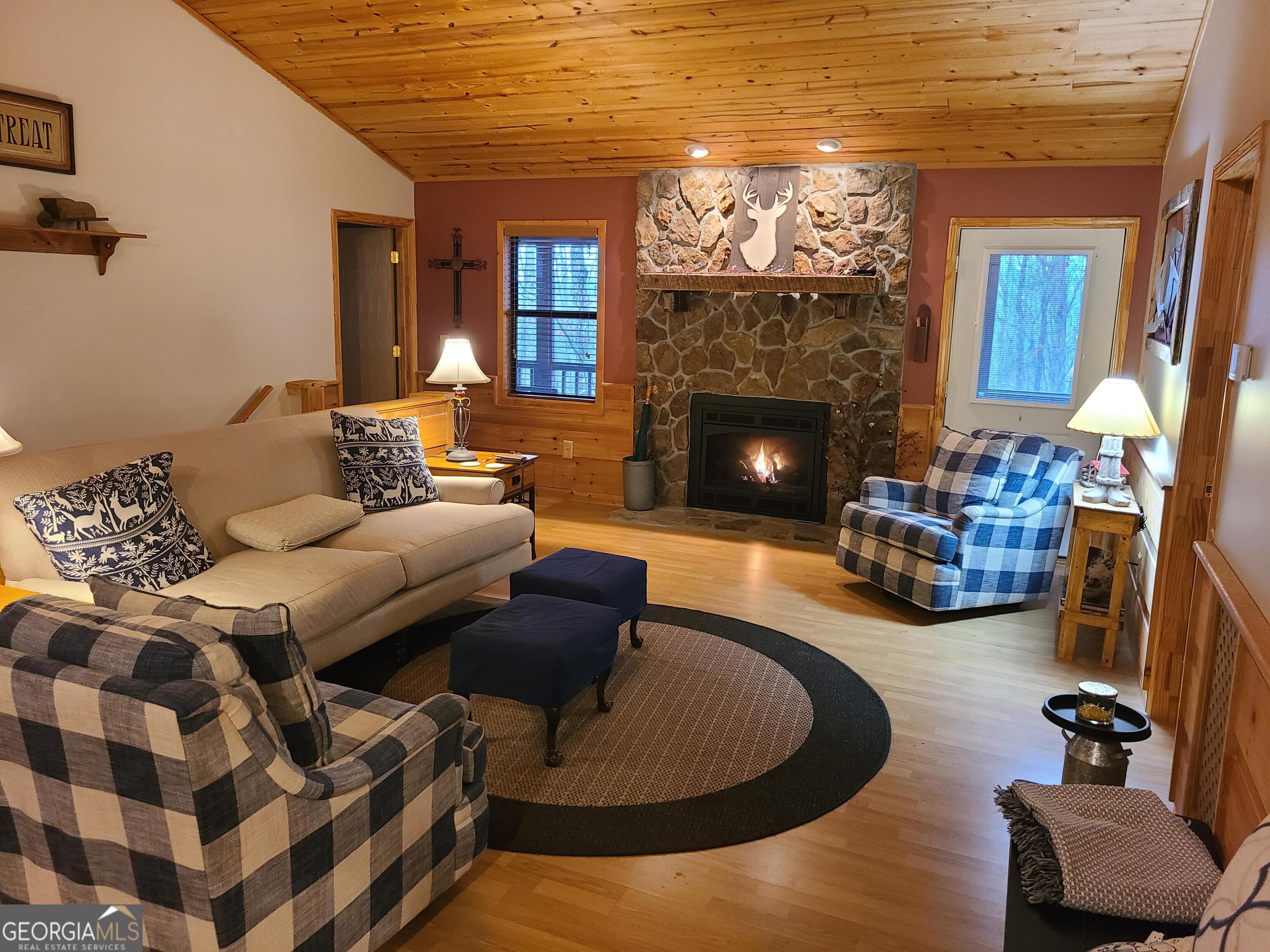 191 Deer Run Road Blairsville, GA 30512 - Photo 5 of 24 a living room with furniture and a fireplace