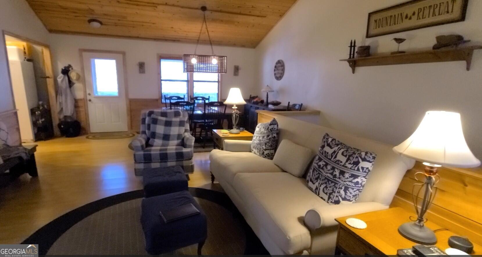 191 Deer Run Road Blairsville, GA 30512 - Photo 6 of 24 a living room with furniture and a chandelier