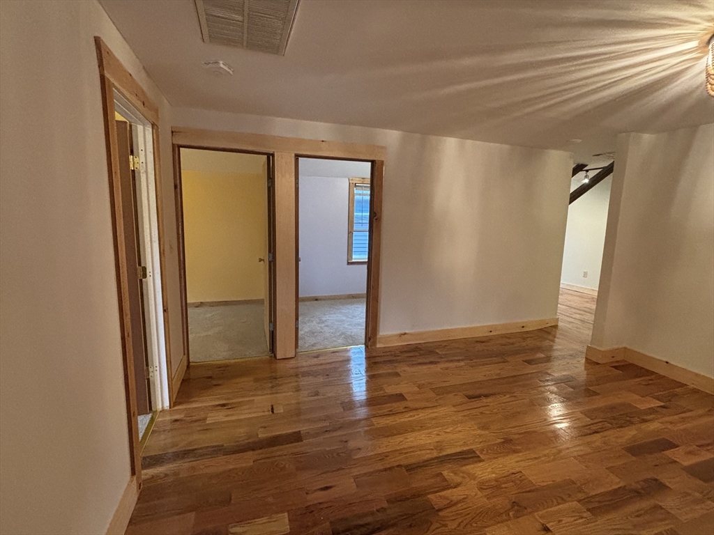 36 Washington Street Greenfield, MA 01301 - Photo 3 of 14 a view of a livingroom with wooden floor