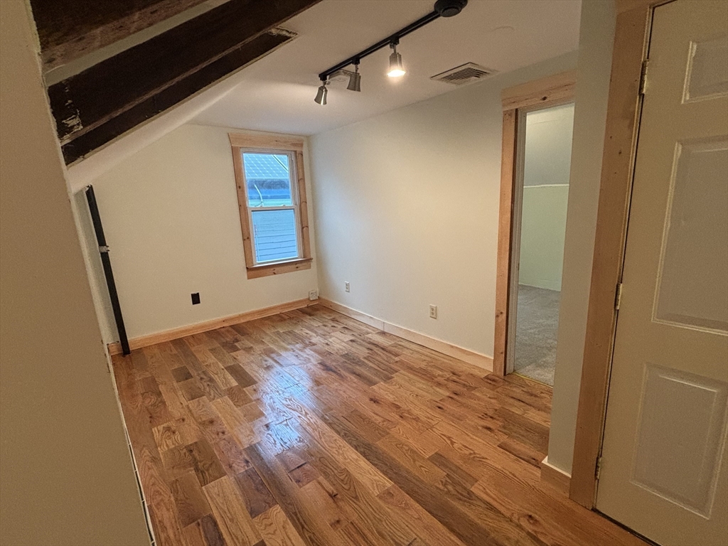 36 Washington Street Greenfield, MA 01301 - Photo 4 of 14 a view of empty room with wooden floor