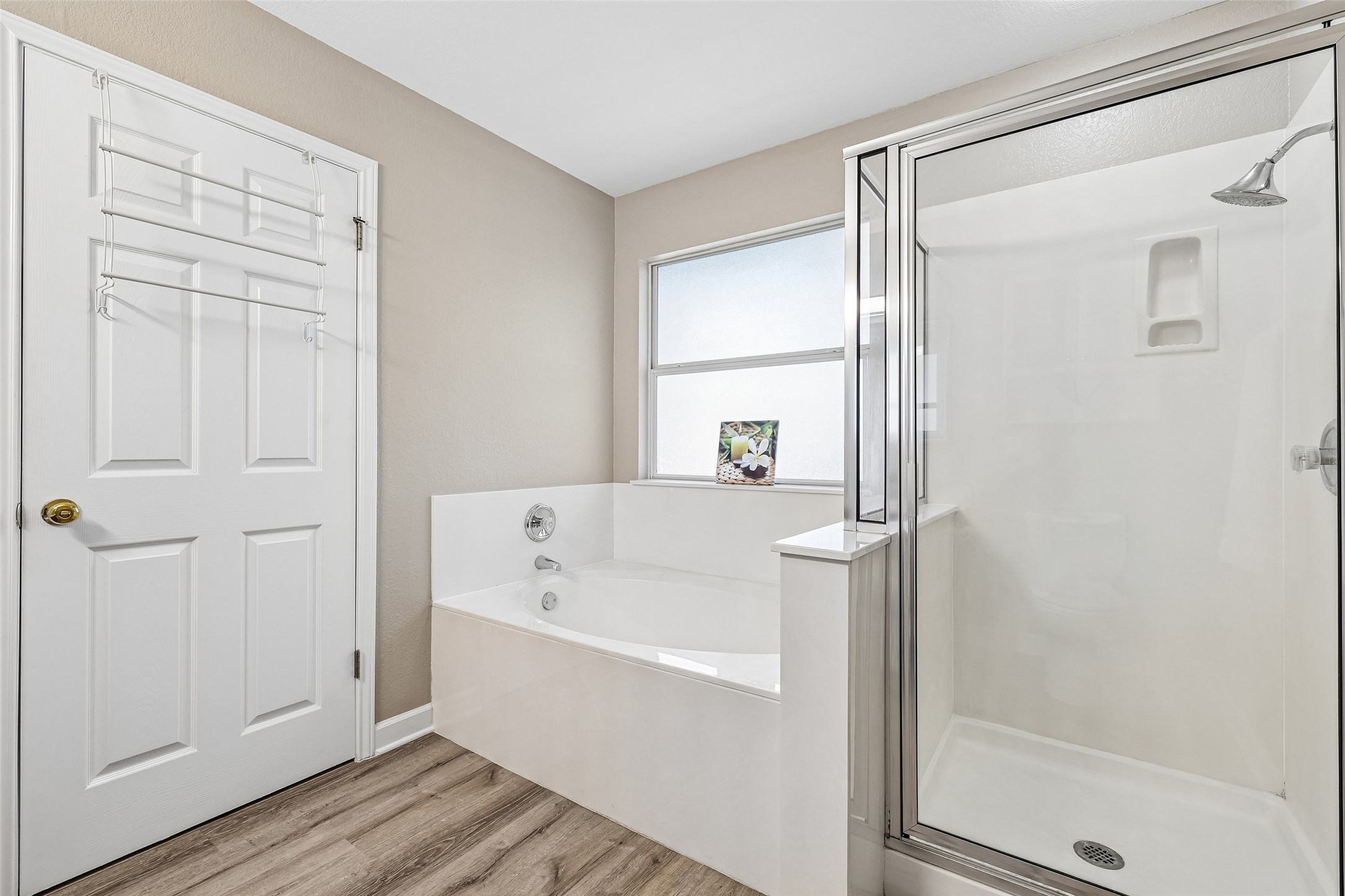 152 Grant Way Kyle, TX 78640 - Photo 29 of 39 a bathroom with a bathtub and a shower