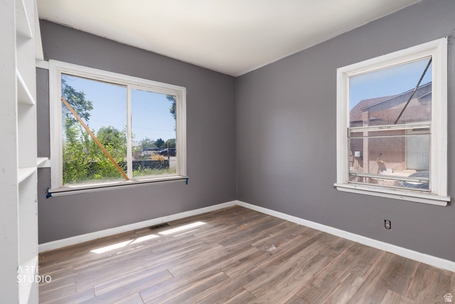 330 West 600th Street South Provo, UT 84601 - Photo 13 of 26 Interior room featuring wood-finish flooring, neutral gray wall paint, and white trim