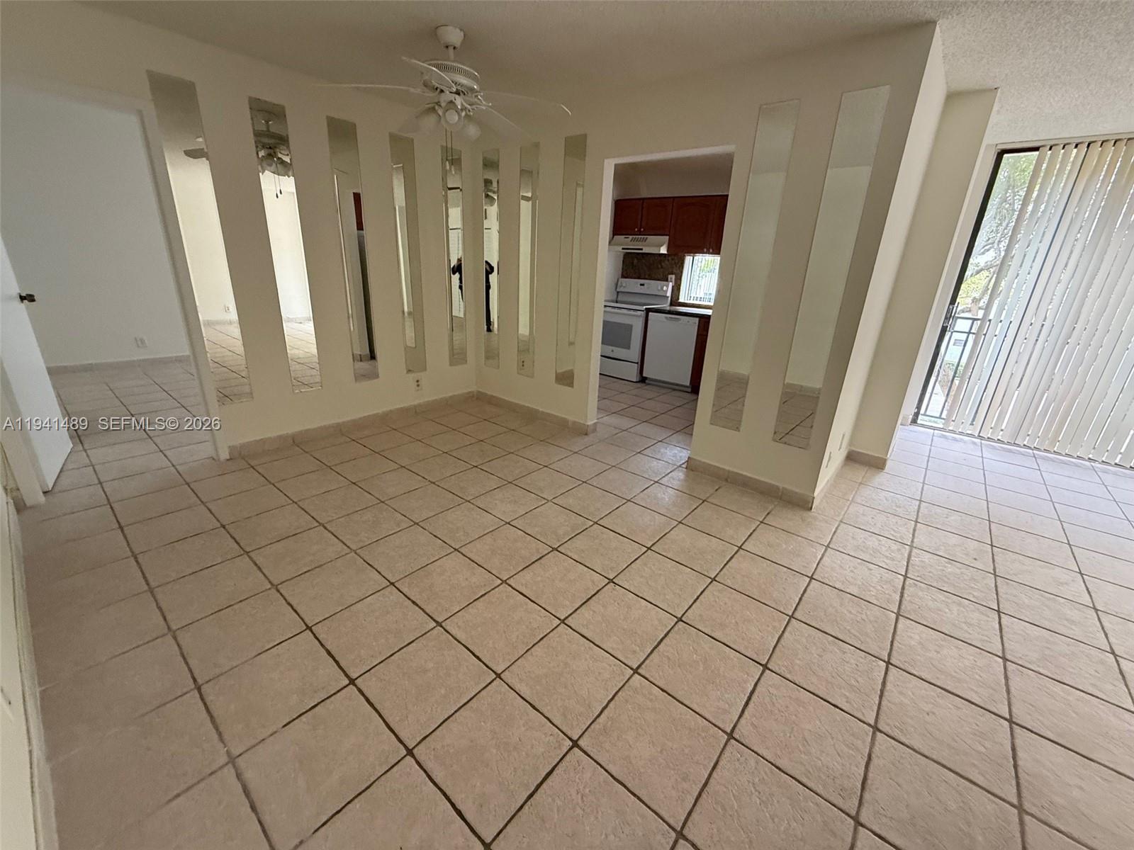 16919 North Bay Road, Unit 314 Sunny Isles Beach, FL 33160 - Photo 28 of 34 an empty room with wooden floor and cabinet