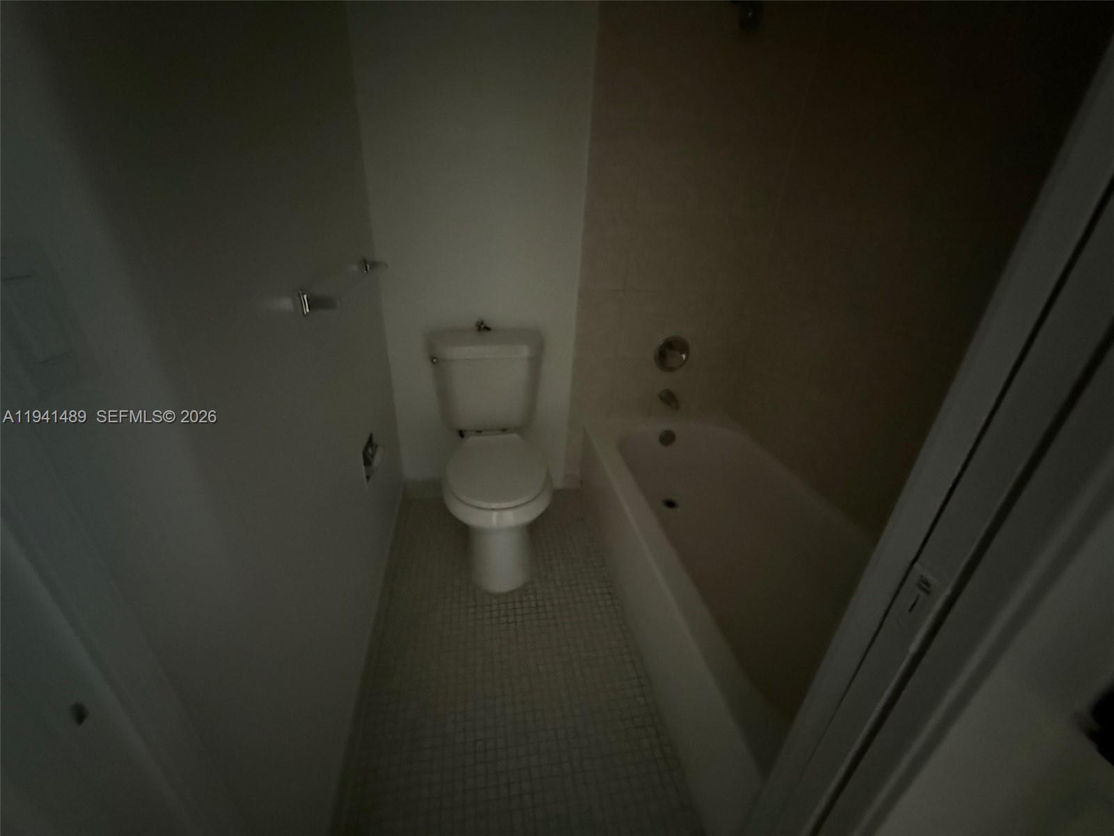 16919 North Bay Road, Unit 314 Sunny Isles Beach, FL 33160 - Photo 33 of 34 a close view of a toilet sink and a vanity in a bathroom