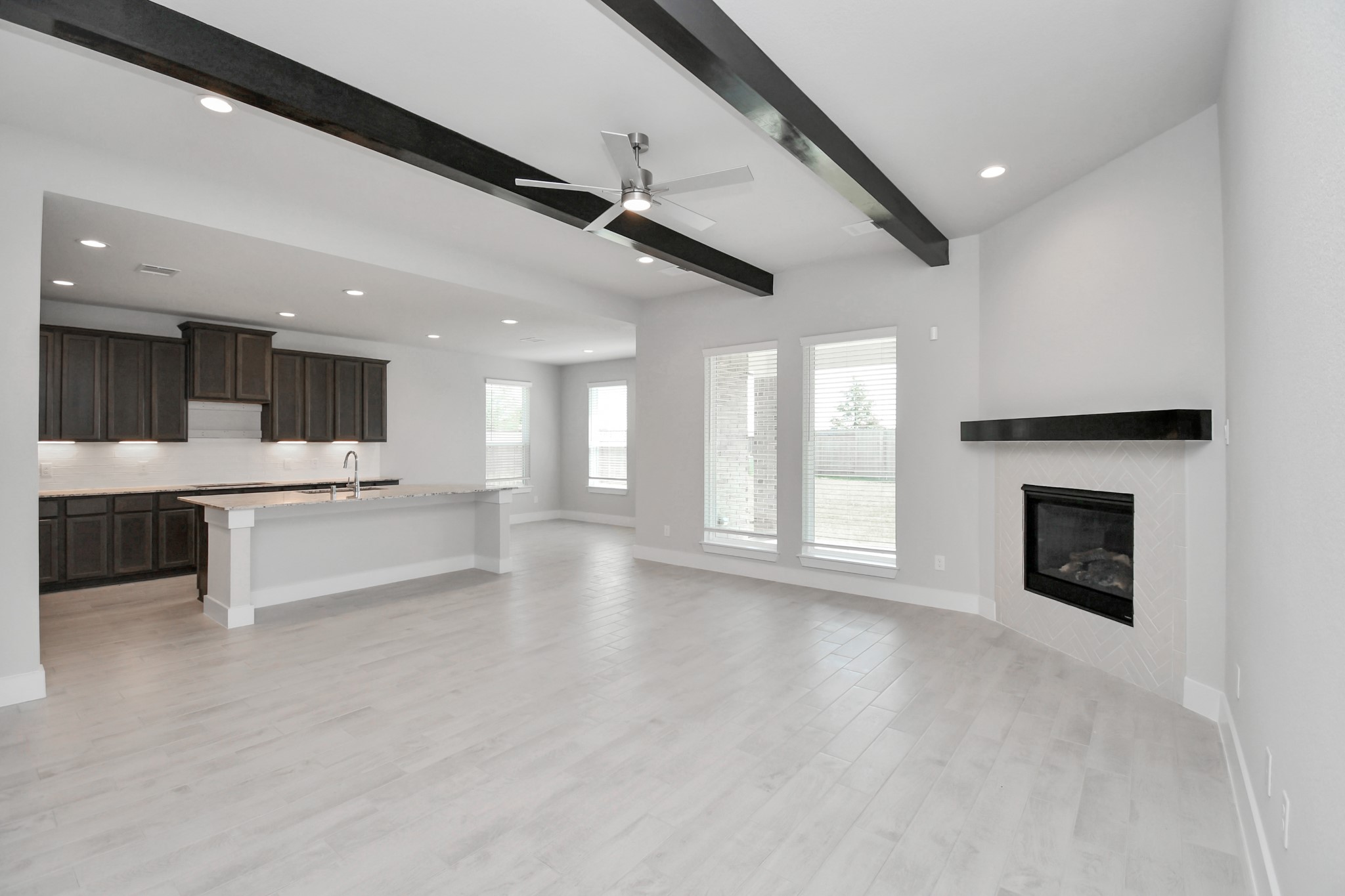3039 Native Spg Drive Spring, TX 77373 - Photo 16 of 40 a view of a kitchen with a sink and a fireplace