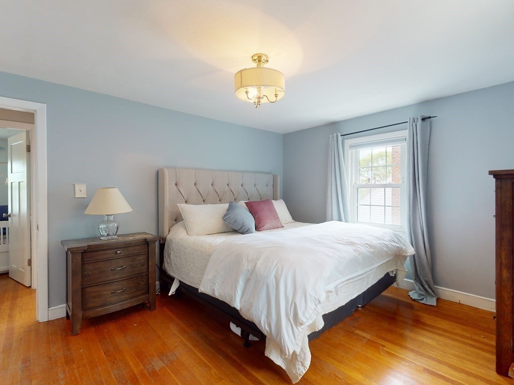 30 Baker Road Arlington, MA 02474 - Photo 18 of 42 a bedroom with a bed and a window