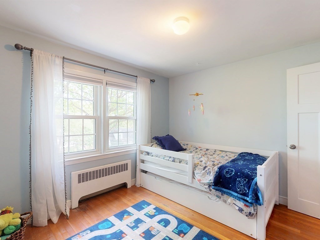 30 Baker Road Arlington, MA 02474 - Photo 21 of 42 a bedroom with a bed and a window