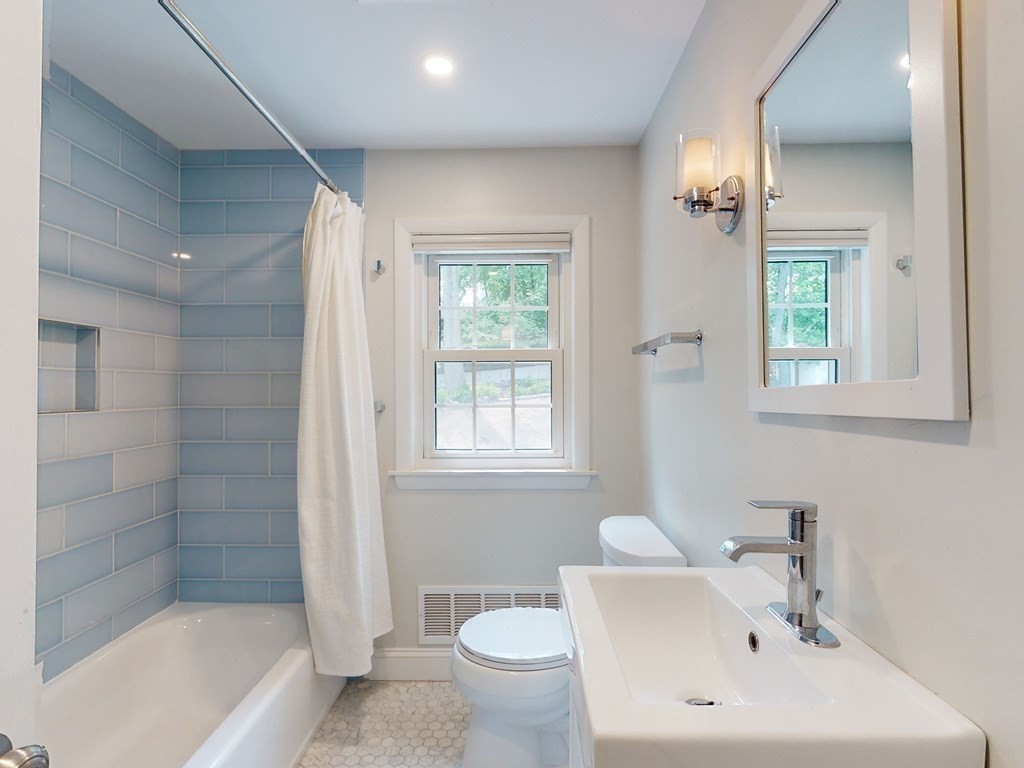 30 Baker Road Arlington, MA 02474 - Photo 23 of 42 a bathroom with a bathtub shower sink and toilet