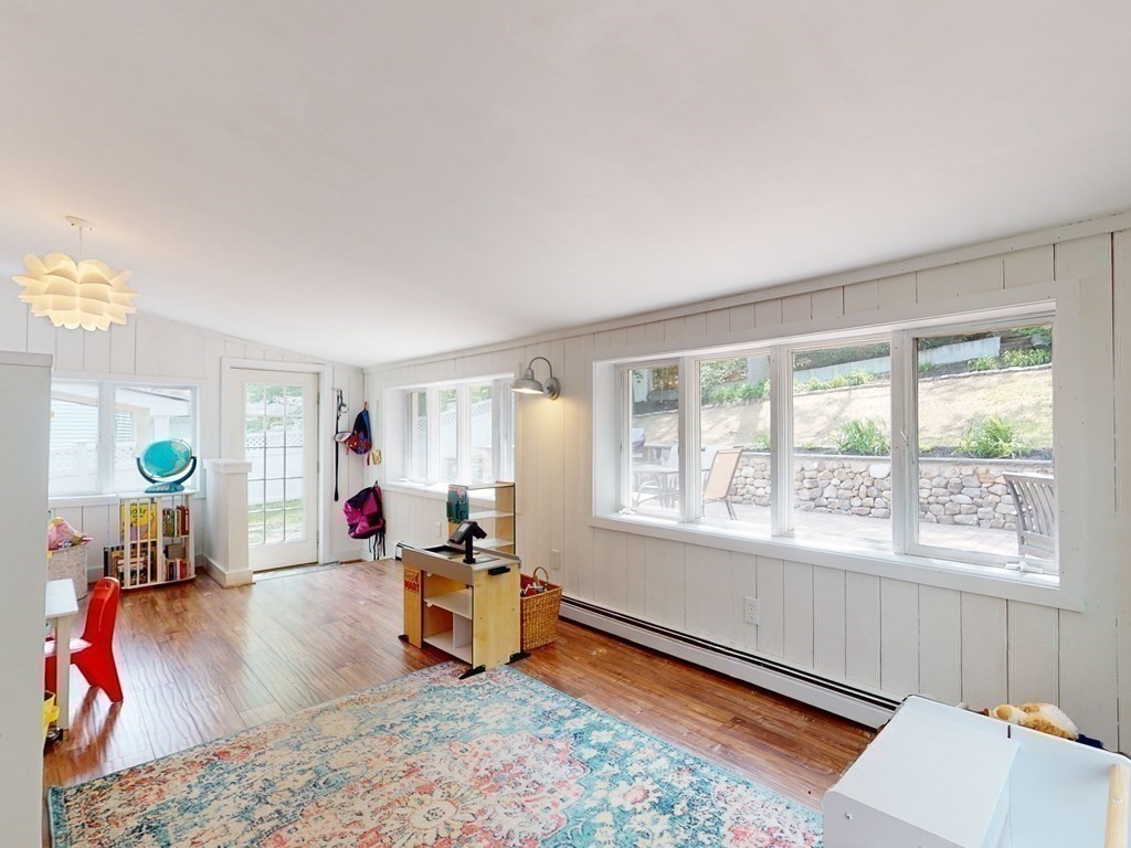 30 Baker Road Arlington, MA 02474 - Photo 25 of 42 a living room with furniture and a window