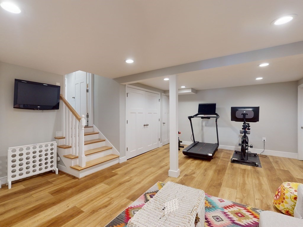 30 Baker Road Arlington, MA 02474 - Photo 29 of 42 a view of a room with wooden floor and stairs