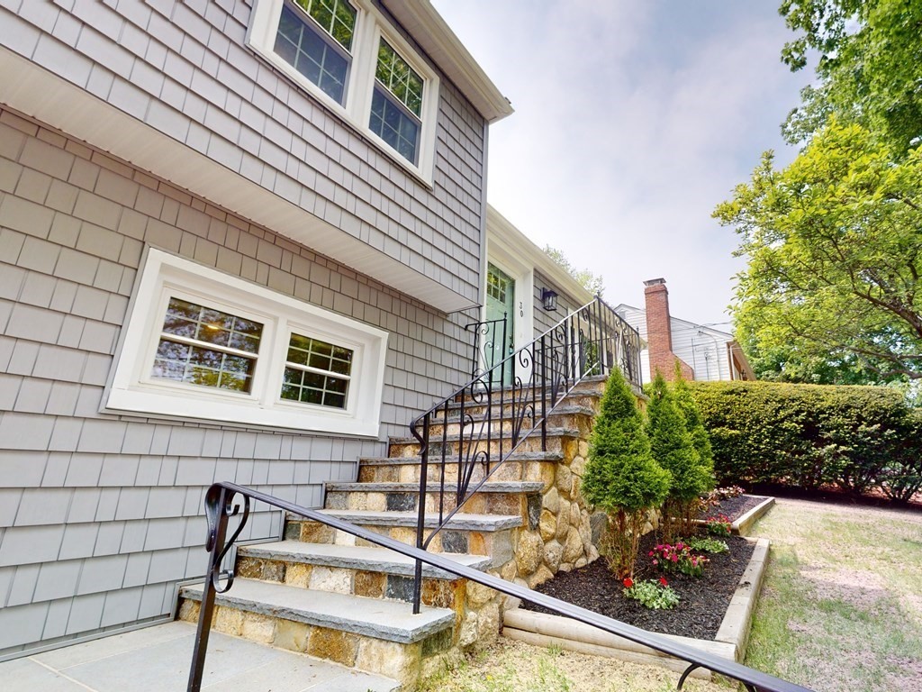30 Baker Road Arlington, MA 02474 - Photo 3 of 42 a view of a balcony with chairs and potted plants