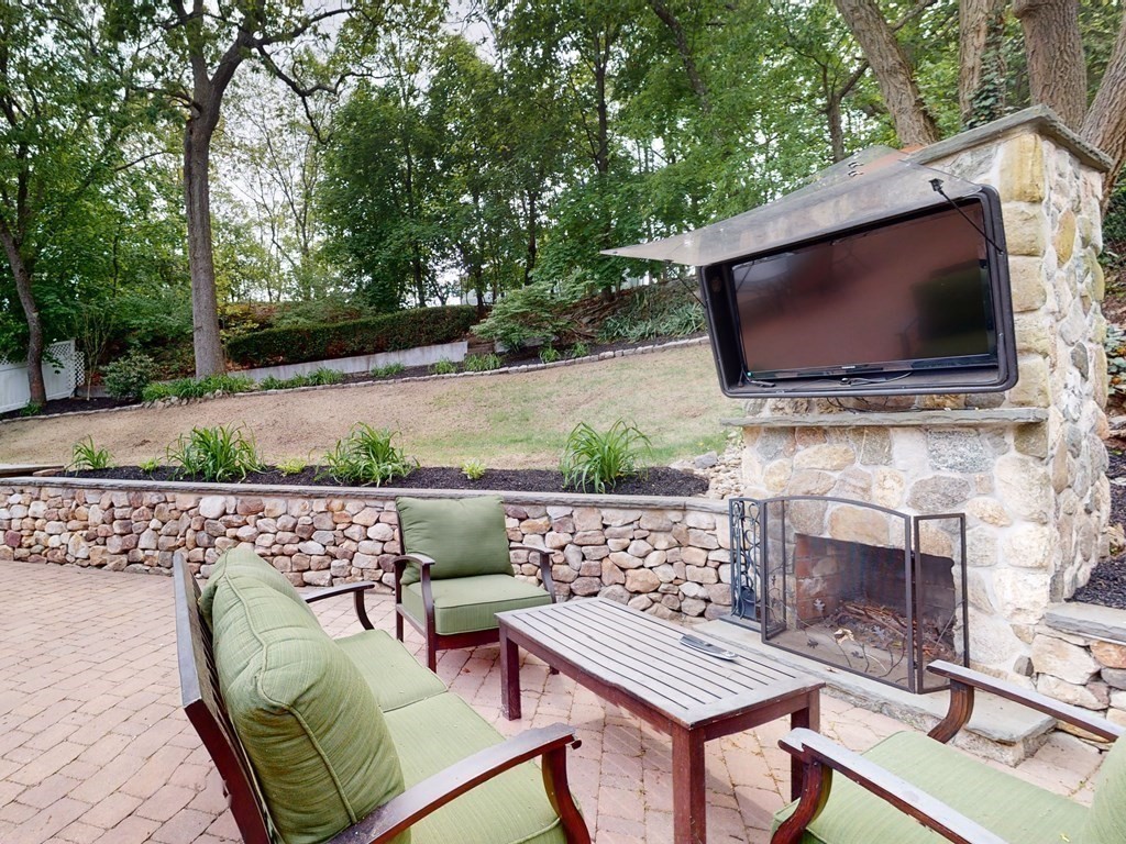 30 Baker Road Arlington, MA 02474 - Photo 34 of 42 a outdoor living space with furniture and a fireplace