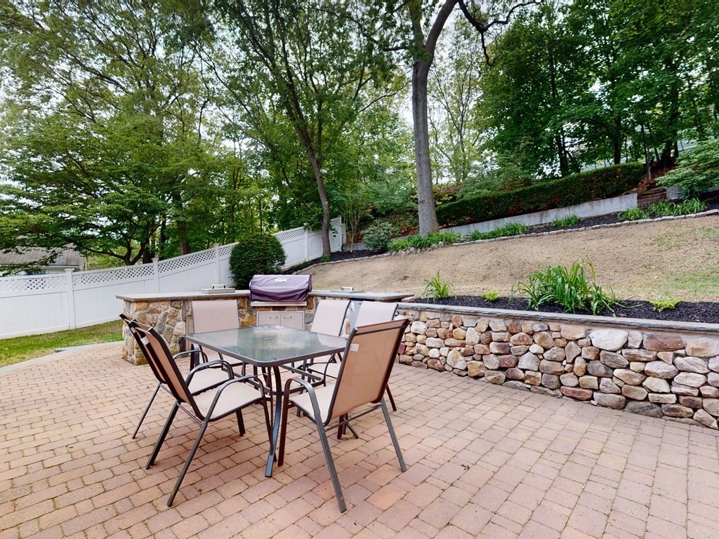 30 Baker Road Arlington, MA 02474 - Photo 36 of 42 a patio with table and chairs