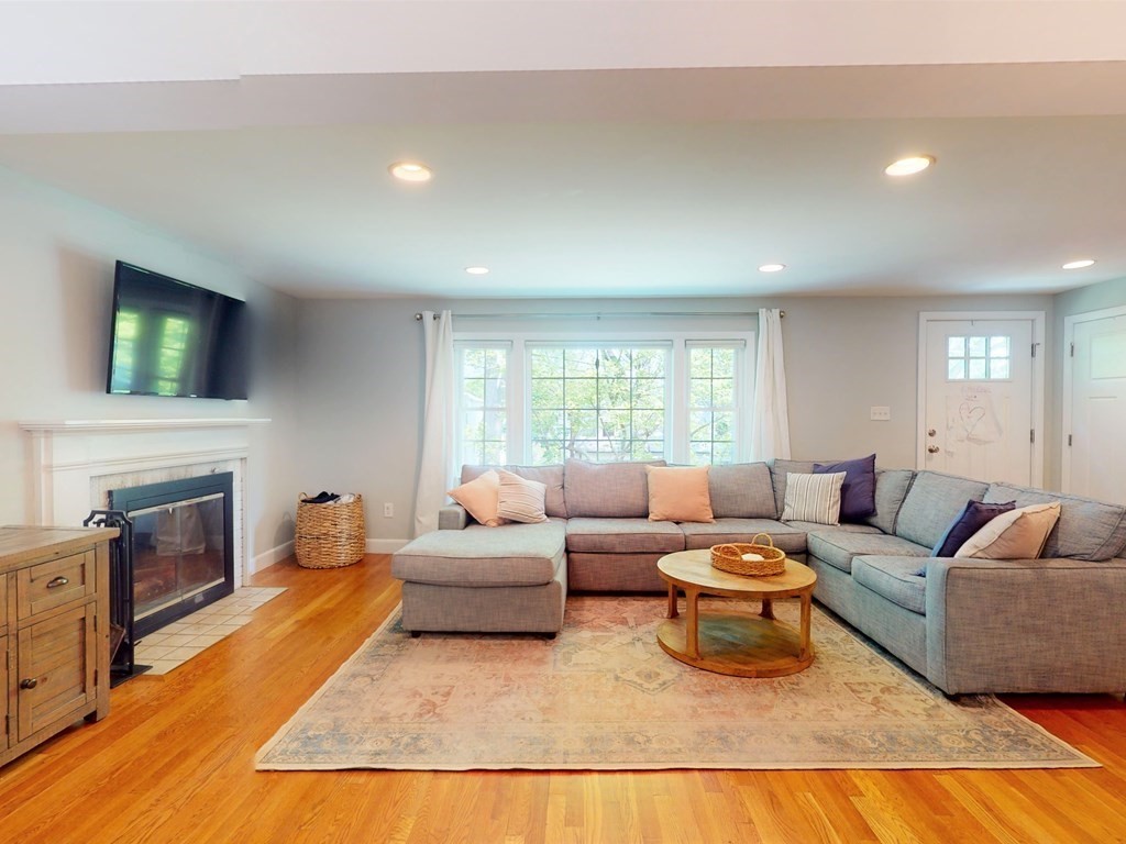 30 Baker Road Arlington, MA 02474 - Photo 7 of 42 a living room with furniture fireplace and flat screen tv