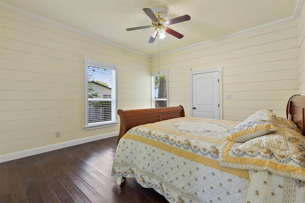 5824 Boone Street Sachse, TX 75048 - Photo 16 of 37 a bedroom with a bed and a window