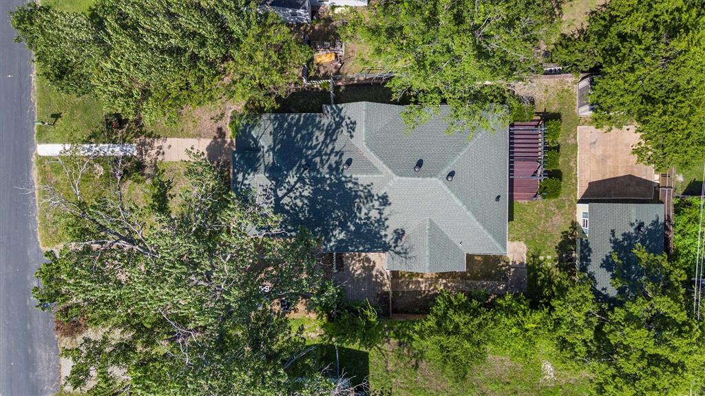 5824 Boone Street Sachse, TX 75048 - Photo 33 of 37 an aerial view of residential house with outdoor space and trees all around