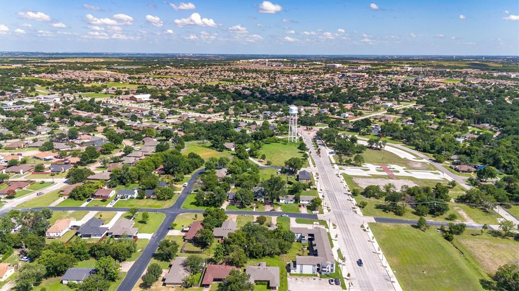 5824 Boone Street Sachse, TX 75048 - Photo 34 of 37 an aerial view of residential houses with outdoor space and a lake view