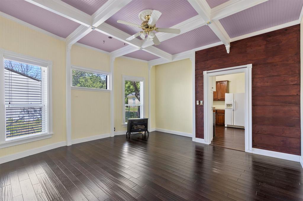 5824 Boone Street Sachse, TX 75048 - Photo 9 of 37 a view of an empty room with window and wooden floor