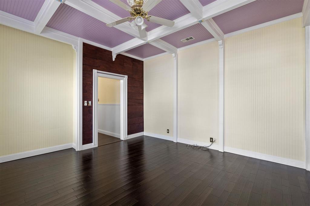 5824 Boone Street Sachse, TX 75048 - Photo 10 of 37 an empty room with wooden floor chandelier fan and closet