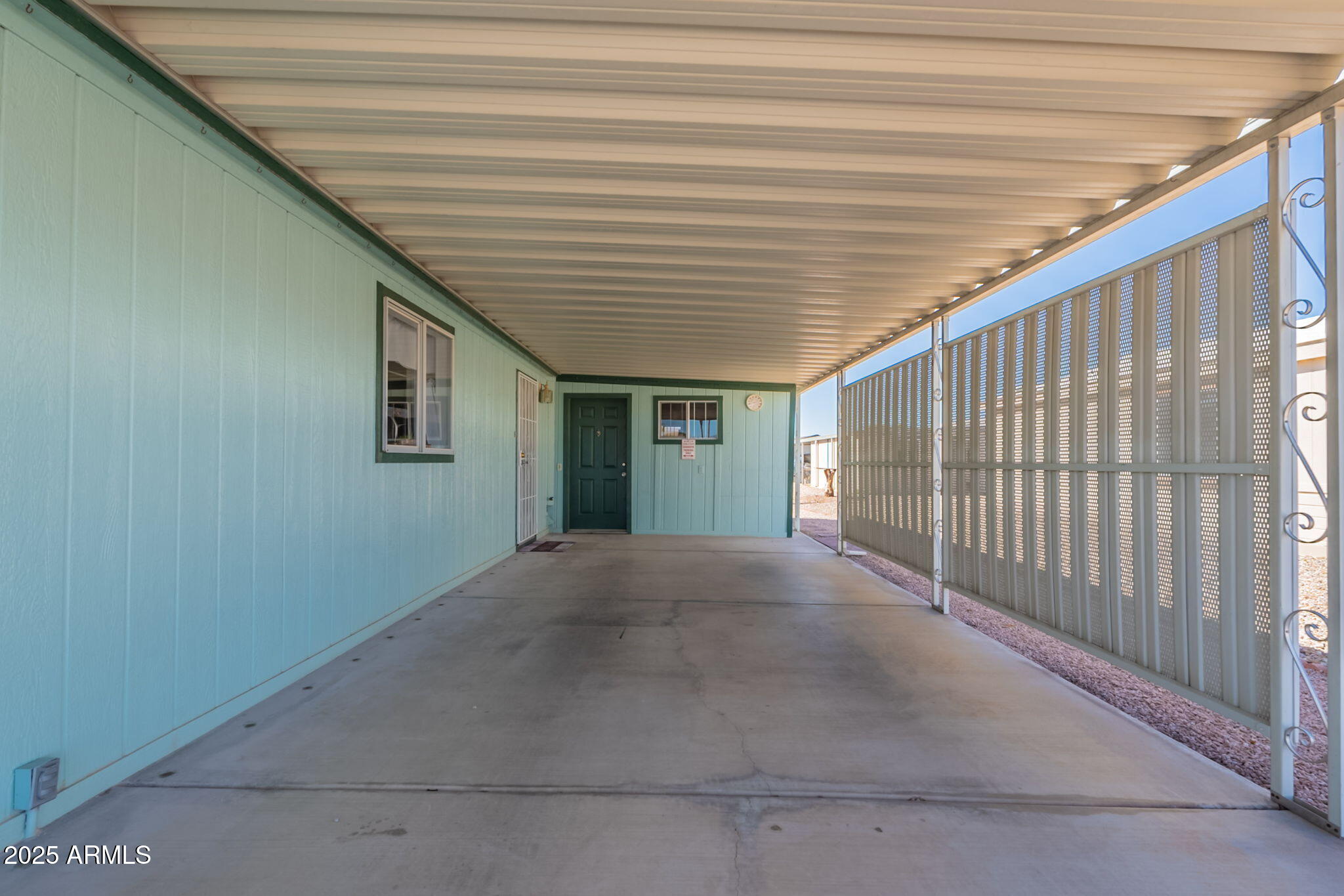 3700 South Tomahawk Road, Unit 39 Apache Junction, AZ 85119 - Photo 13 of 53 Carport looking towards workshop/shed
