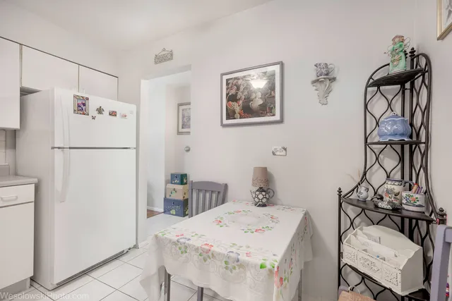 a white refrigerator freezer sitting inside of a kitchen