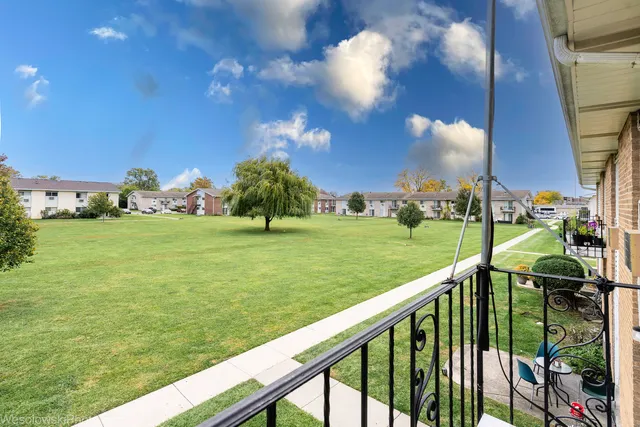 a view of a garden from a balcony