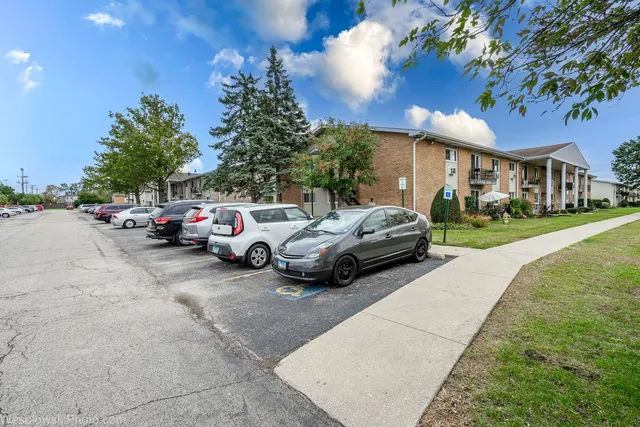 a view of a cars parked in front of a house