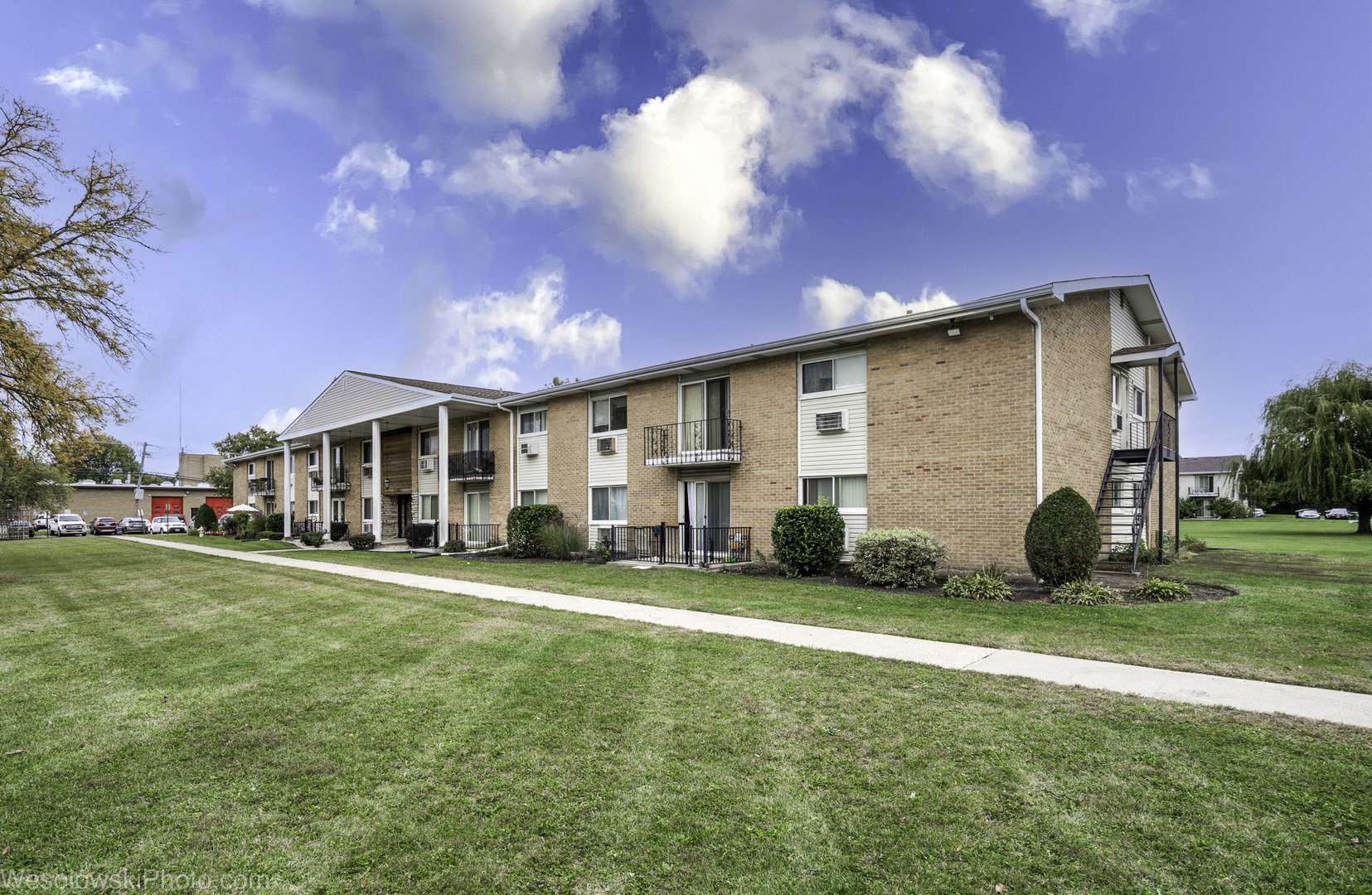 9209 Potter Road, Unit 2F Des Plaines, IL 60016 - Photo 25 of 25 a view of a house with a big yard and large trees