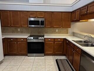 4223 Jade Loop Destin, FL 32541 - Photo 17 of 40 a kitchen with granite countertop a sink and a stove top oven