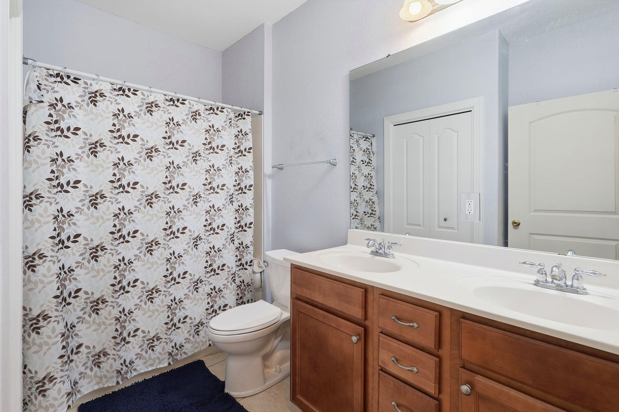 4223 Jade Loop Destin, FL 32541 - Photo 23 of 40 a bathroom with a sink toilet and shower