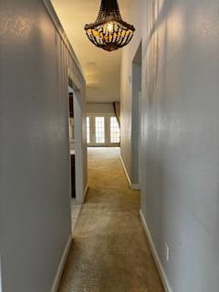 4223 Jade Loop Destin, FL 32541 - Photo 10 of 40 a view of a hallway with chandelier