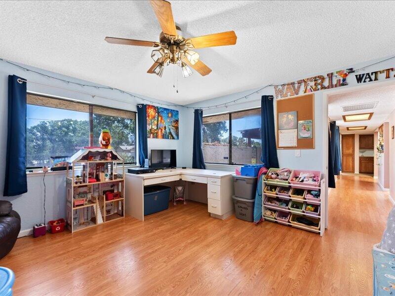 19907 Hidden Hills Road Cottonwood, CA 96022 - Photo 11 of 20 a living room with furniture and a large window
