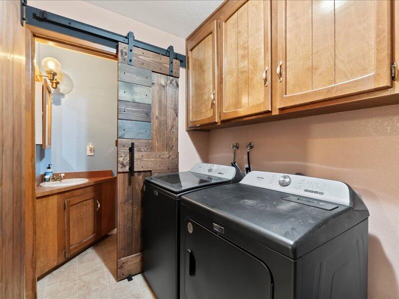 19907 Hidden Hills Road Cottonwood, CA 96022 - Photo 12 of 20 a kitchen with a sink and cabinets