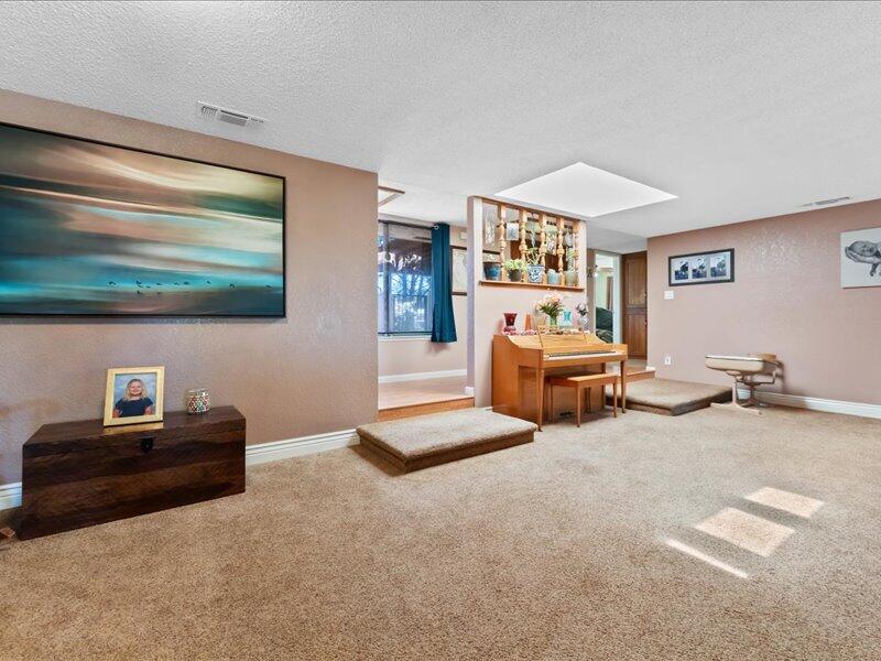 19907 Hidden Hills Road Cottonwood, CA 96022 - Photo 3 of 20 a bedroom with furniture and a projector